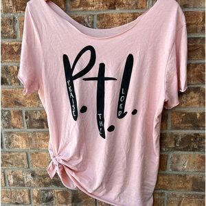 Distressed Tshirt. Off shoulder. Praise the Lord” on front